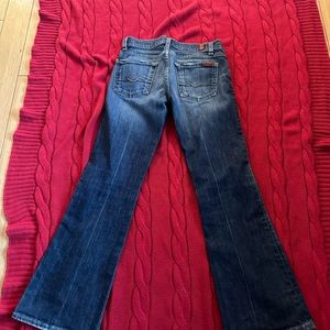 Blue distressed denim size 24 with 27 inseam.